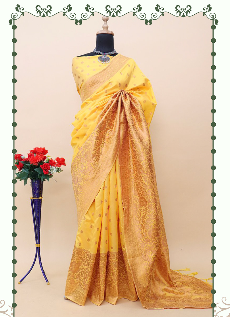 Yellow silk cotton saree with peacock & paisley buttas, contrast zari  border & intricate pallu of floral vine