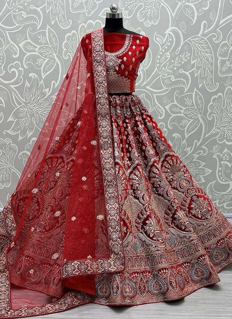 FIERY RED LEHENGA SET WITH MULTI COLOURED THREAD WORK AND SILVER HIGHLIGHTS  PAIRED WITH A CORSET CUT BLOUSE AND A MATCHING DUPATTA. - Seasons India